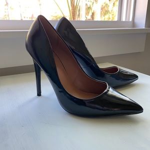 Shiny black pointed toe stilettos